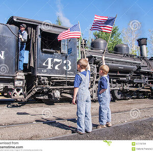 boys-waving-american-flags-train-engineer-two-young-standing-tracks-wearing-overalls-wave-gets...jpg